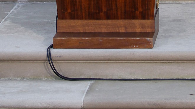 Rodent runs by Obama podium