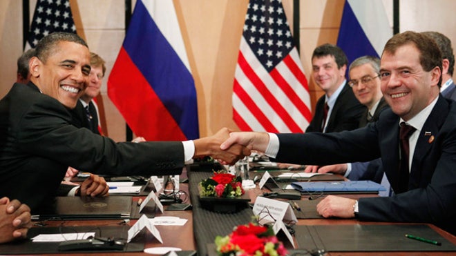 Obama shakes with Medvedev