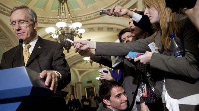 Reid at podium on taxes