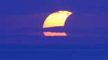 A partial ring of fire solar eclipse arced across the Australia, Indonesia and Hawaii Thursday, blotting out the sun and offering stunning views to skywatchers.