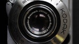 Eastman Kodak said Thursday it will take a $ million charge to exit the digital camera, pocket video camera and digital picture frame business in the first half of , as the bankrupt firm shifts more focus to its core consumer business.