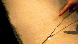 An ancient limestone tablet covered with a mysterious Hebrew text that features the archangel Gabriel is at the center of a new exhibit in Jerusalem, even as scholars continue to argue about what it means.
