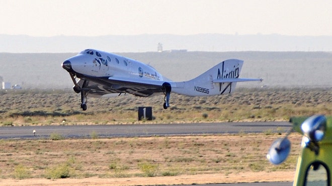 SpaceShipTwo lands after a successful glide test June 21