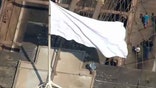 White flags mysteriously replace American flags on top of Brooklyn Bridge