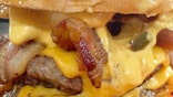 Woman dislocates jaw after biting into a triple hamburger
