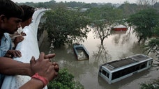 Monsoon flooding that has stranded thousands of people and caused landslides in northern India has killed almost  people, and the prime minister said the toll could rise substantially.