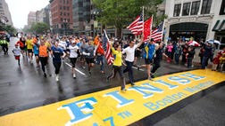 Thousands of athletes joined victims of the Boston Marathon bombings to run and walk the last mile of the race Saturday, reclaiming the triumph of crossing the finish line.