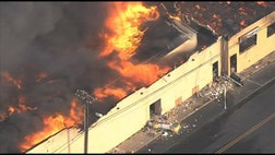 >A raging fire that apparently started in an ice cream shop raged along a New Jersey boardwalk badly damaged in Superstorm Sandy, destroying more than 30 businesses.