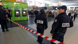 A French soldier was stabbed in the throat in a busy commercial district outside Paris on Saturday, and France's president said authorities are investigating any possible links with the recent s...