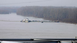The Coast Guard says crews hope to start work Wednesday to remove thousands of gallons of oil from a damaged barge on the Mississippi River, but it's not clear how long that could take or when the river will reopen.