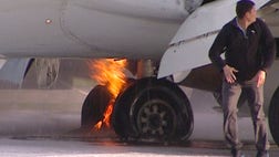 Part of an airliner carrying more than  people caught fire as it was landing in Moscow, and passengers evacuated the plane by jumping off one of its wings and shooting down an evacuation slide.