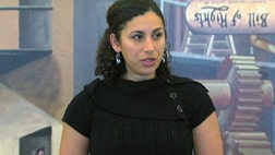 A woman who says she was ethnically targeted for a strip search at Detroit Metropolitan Airport filed a lawsuit Tuesday against an airline and federal transportation officials.