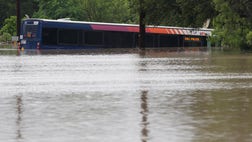 Torrential rains swamped San Antonio with flash floods on Saturday, leaving at least one person dead as emergency workers in boats rushed to rescue more than  residents stranded in cars and homes.
