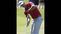 Golf's governing bodies approved a new rule Tuesday that outlaws the putting stroke used by four of the last six major champions, going against two major golf organizations that argued long putters are not hurting the game.