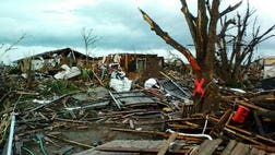At least  people, including nine children, are confirmed dead after a massive tornado with winds up to  mph decimated scores of buildings and landed a direct blow on an elementary school in Moore, Okla.