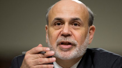 Several Federal Reserve policymakers this month favored slowing the Fed's efforts to maintain record-low long-term interest rates as early as June -- if the economy showed strong and sustained growth. But those officials appeared at odds over what evidence would demonstrate such gains.