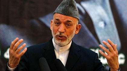 Afghan President Hamid Karzai says he will refuse peace talks with the Taliban in a newly-opened office in Qatar unless only Afghans are involved and violence stops, after the militant group claimed responsibility for an attack that killed four American troops.