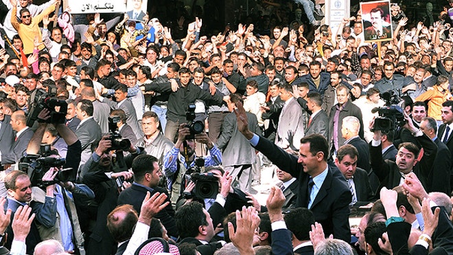 Syrian President Assad Waves in Crowd AP