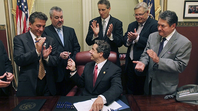 ... a bill legalizing same-sex marriage, at the Capitol in Albany, N.Y.AP ... a bill legalizing same-sex marriage, at the Capitol in Albany, N.Y.AP