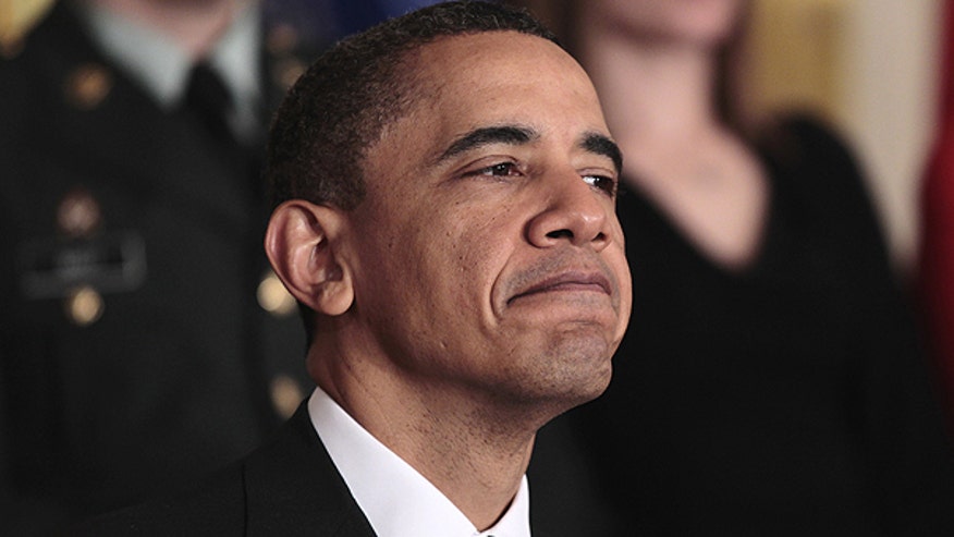 Obama Listens During Event to Launch Joining Forces AP