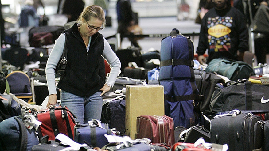 Woman Searching for Lost Bag at Airport AP