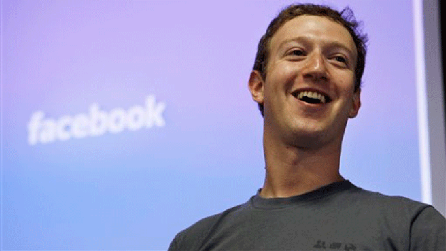 Facebook founder Mark Zuckerberg smiles AP