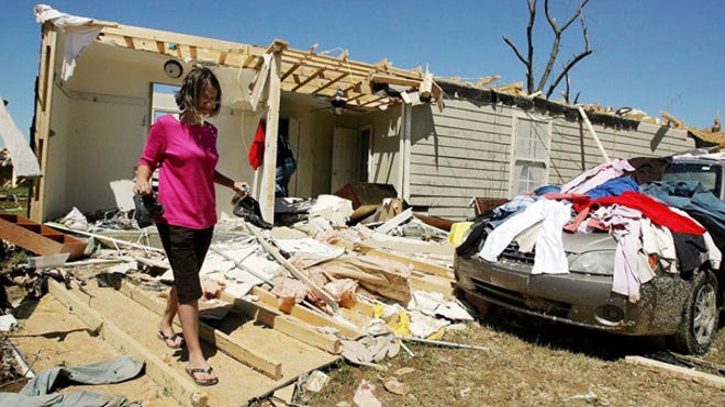 Woman in tornado destruction
