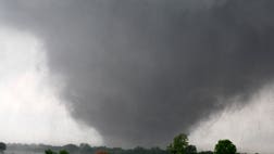 A mile-wide tornado barrels through Oklahoma City's suburbs, causing significant property damage for the second day in a row. Dozens of tornadoes churned through Kansas, Oklahoma and Iowa, killing at least one person, injuring dozens and wreaking devastation across the Midwest.