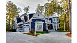 Pergolas aren't just for the backyard. Mount them over the garage to add a graceful flourish to your home's facade.