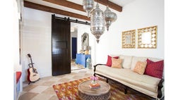They’re called sliding barn doors, but the popular, space-saving feature doesn’t have to be country. Dallas-based designer Laura Umansky explains how to incorporate the look into any home.