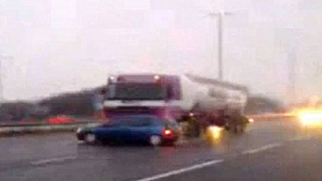 Car Stuck Under Truck