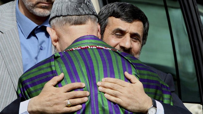Ahmadinejad hugs Karzai