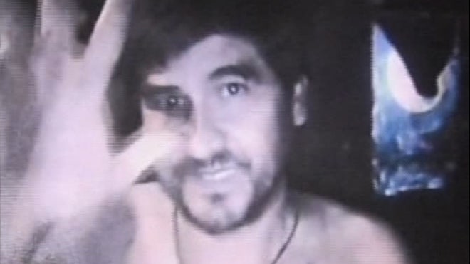 Trapped Chilean miner waves to camera