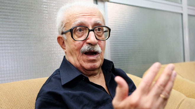 Tariq Aziz motions with hand