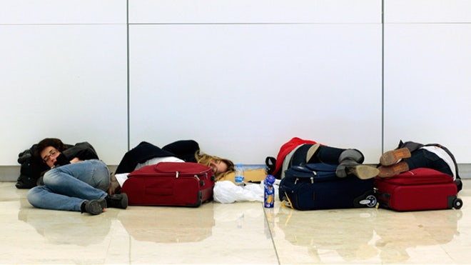 Travelers sleep at Madrid airport