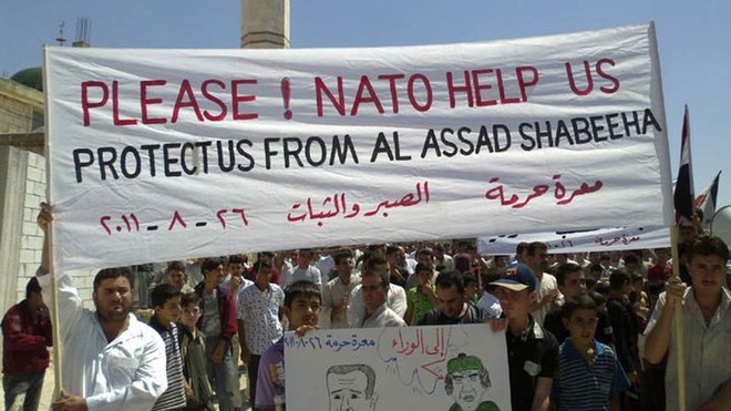 syria protesters nato help sign
