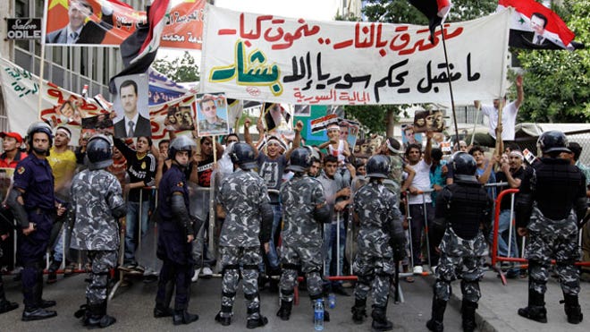 syria protests riot police
