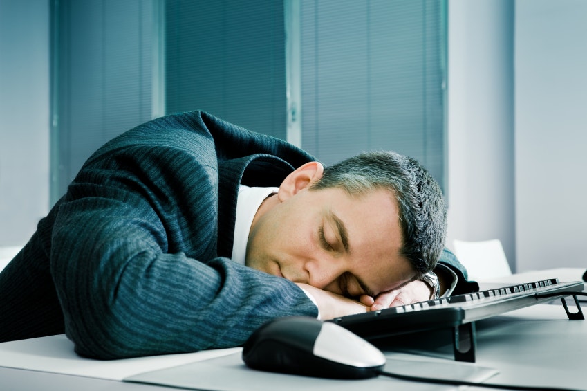 Businessman sleeping at desk