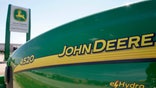 The world's largest farm equipment maker, Deere reported higher quarterly earnings that topped estimates and lifted its full-year outlook.