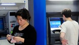 Some brick-and-mortar banks are planning leaner, more automated branches, but can it help them reclaim market share from online banks?
