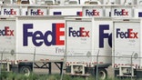 The shipping giant reported mixed fourth-quarter earnings but warned of near-term challenges.