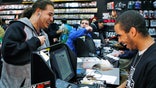 The world's largest retailer of video game products, reported quarterly results ahead of Wall Street estimates helped by higher sales of mobile devices and digital content.