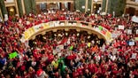 Facing large protests from state workers and a Democratic revolt in the legislature, Wisconsin's Republican Governor Scott Walker called his proposals to curb union rights and cut worker benefits a modest request.