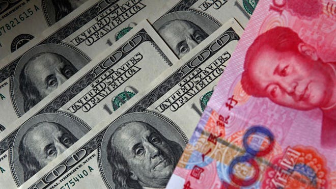 Yuan-Banknote-Next-to-US-Dollars
