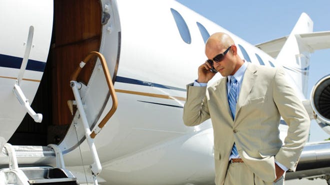 airplane-private-jet-businessman-phone