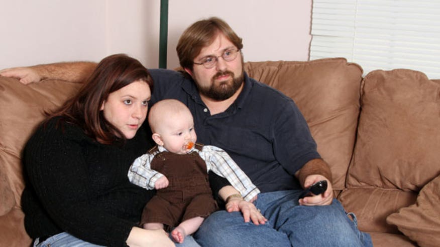 Couple-Baby-Couch-Watch-TV