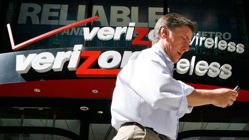 Man Walks Past Verizon Wireless Store