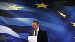 Greek lawmakers on Sunday approved a reform law to unlock about .
