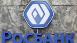 The head of Societe Generale's  Russian unit Rosbank faced up to seven years in jail for bribery on Thursday after Russian investigators released a film of him with cash piled on his desk in what several bankers said may have been a set up.