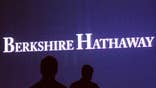 Warren Buffett's Berkshire Hathaway Inc   had its credit rating cut one notch by Standard  Poor's, which cited a new methodology for evaluating insurers and Berkshire's dependence on its insurance business for dividend income.